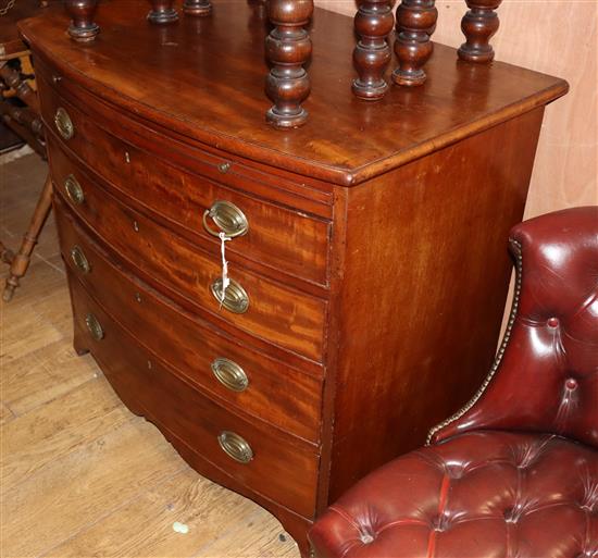 A George III mahogany bowfront chest with brushing slide, W.92cm D.58cm H.82cm